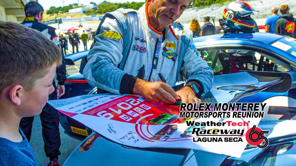 Race Car Driver Signing Autograph For Kids at Rolex Monterey Motorsports Reunion