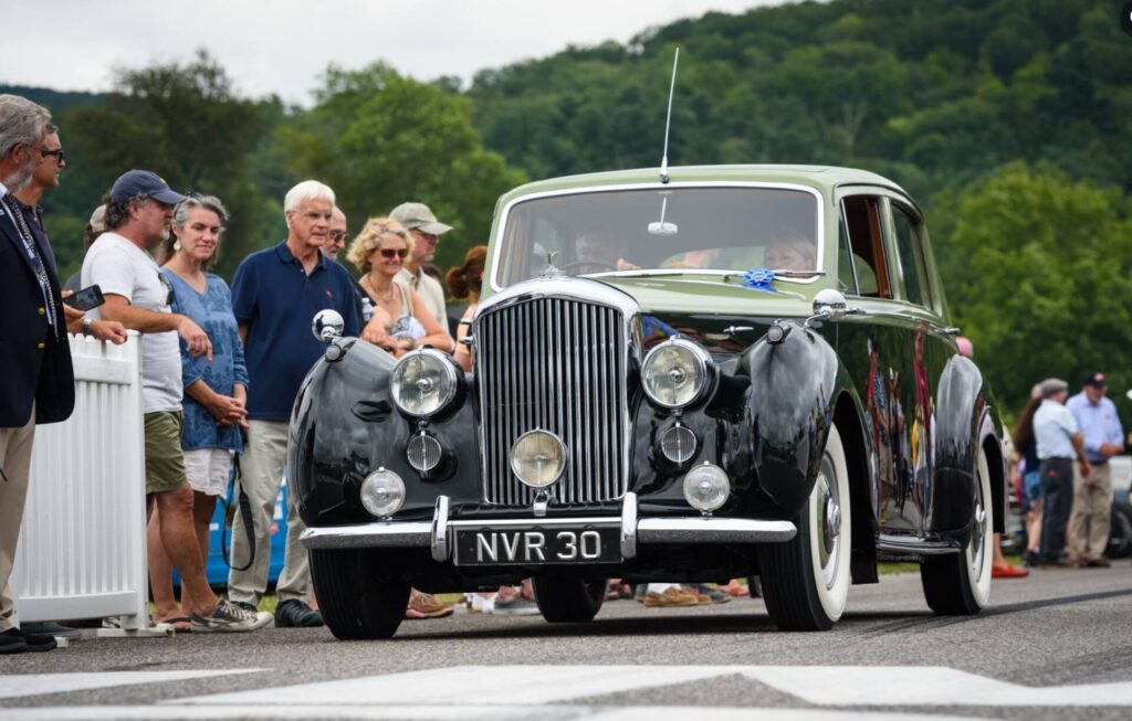 1949 Bentley car with people waching