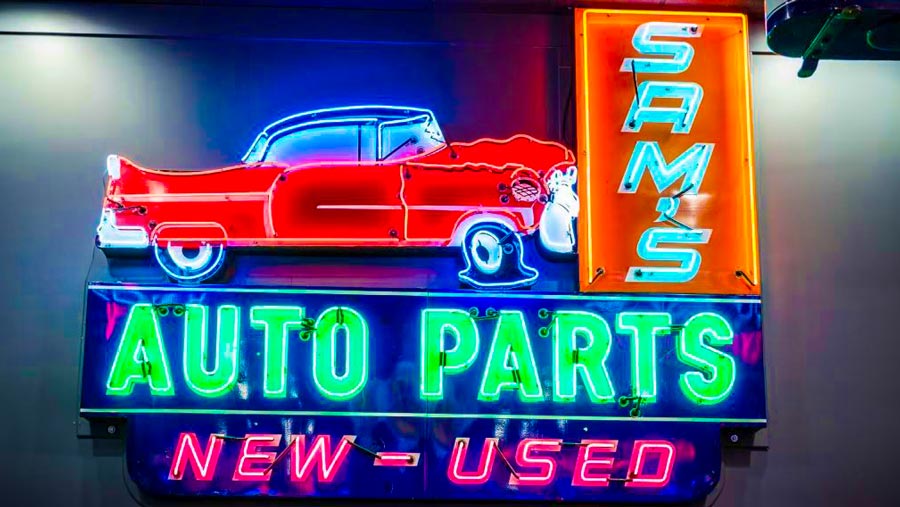 an iconic American 1950s porcelain Used Car Neon Sign