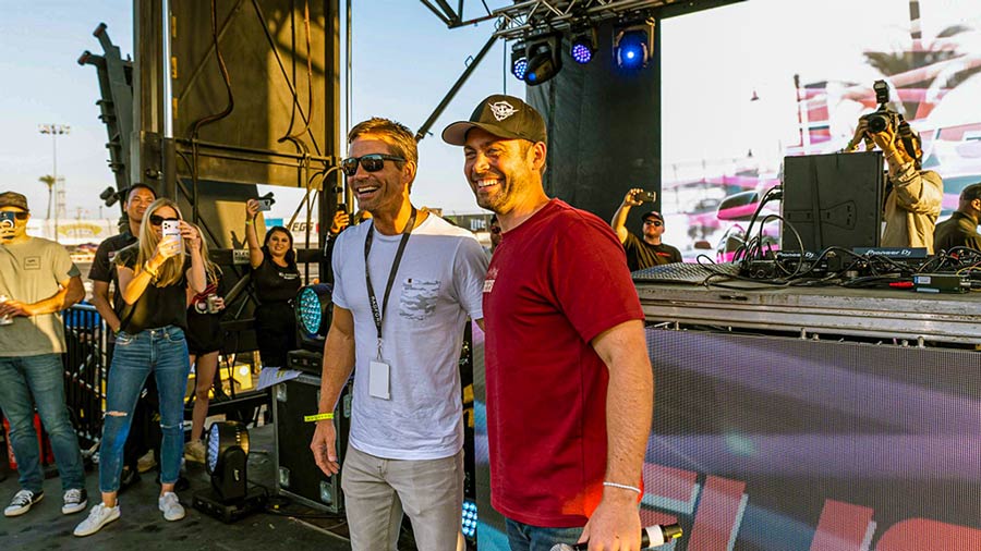 Cody Walker At Fuelfest in a phot-op with a VIP guest after a live stage performance