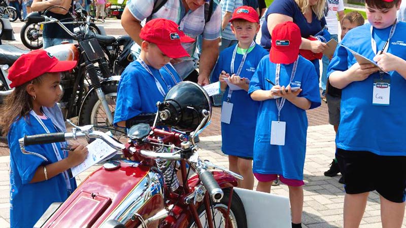 Kids judging a motorcycle for quality and originality
