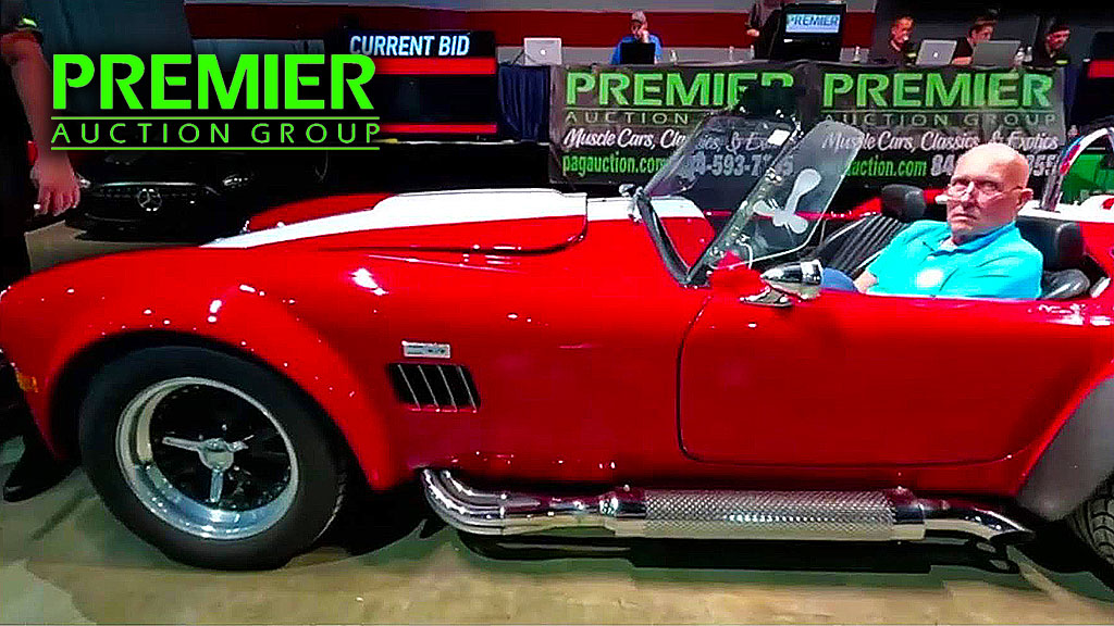 A classic cobra car up for auction on the auciton floor