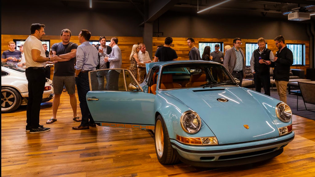 A car collector party inside the The OTTO Car Club