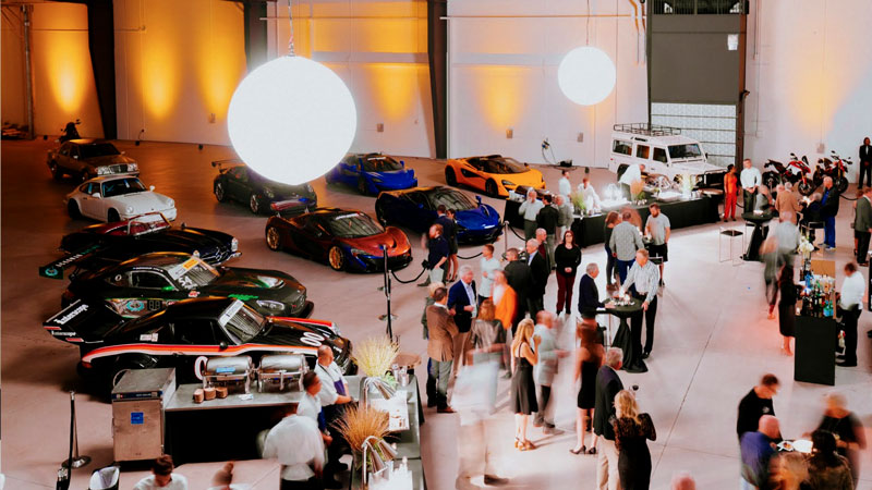 Inside the OTTO Car Club’s luxury lounge, guests gather