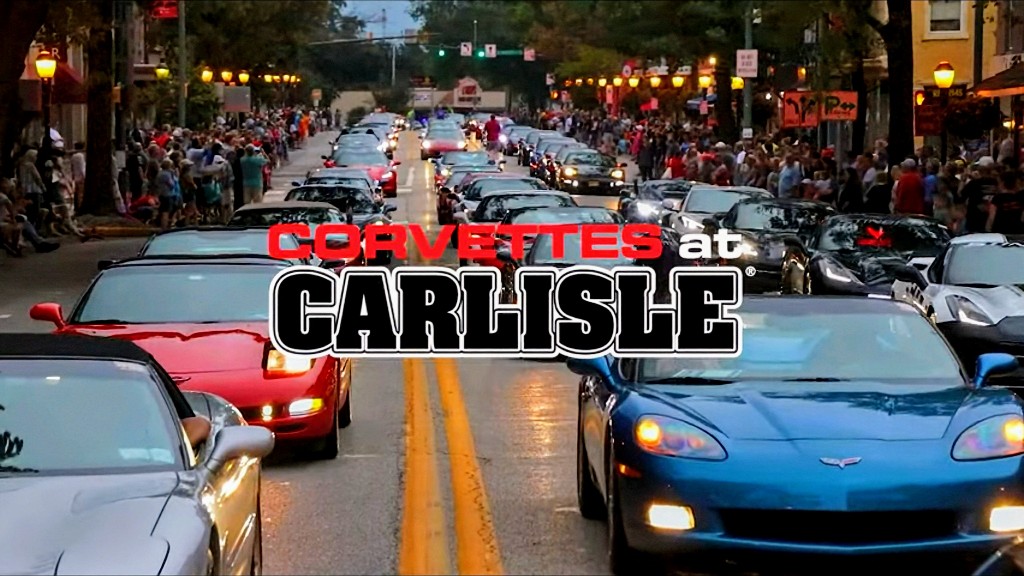Hundreds of Corvettes driving down mainstree with crowd cheering