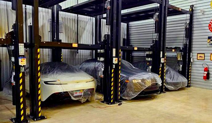 Three expensive collector cars in storage.