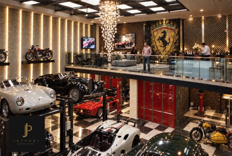 Jetport Motor Suites Car Condo Interior View of a man looking over his car collection